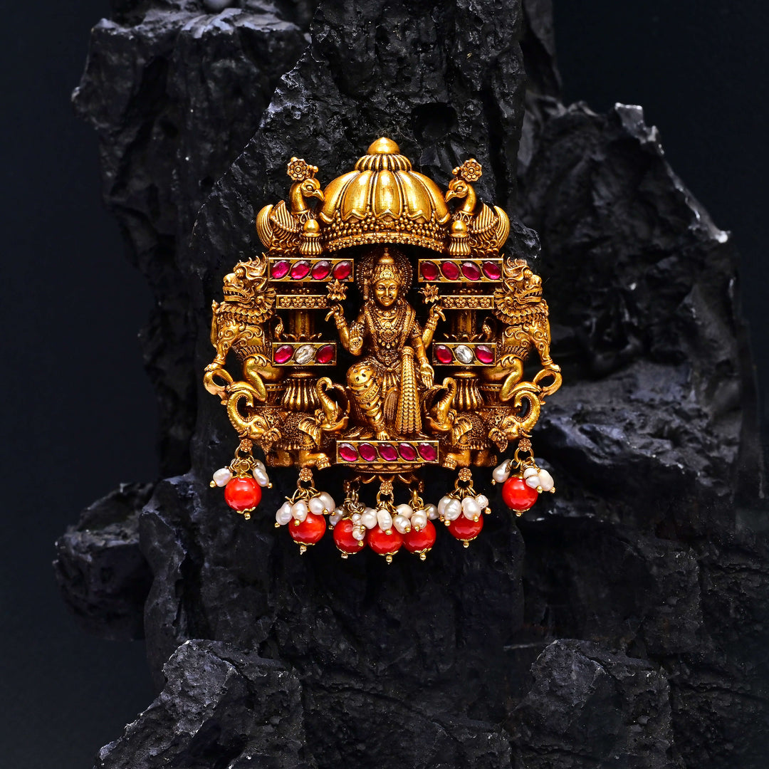 Premium 92.5 silver temple pendant featuring traditional Lakshmi motif, kemp stones, antique finish and intricate handcrafted South Indian design by Sri Fine Jewellery, Hyderabad.
(https://www.srifinejewellery.com)