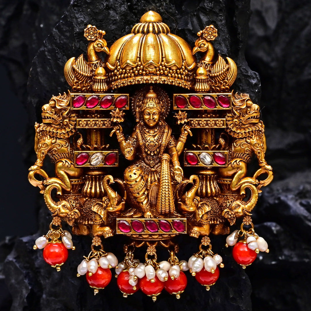 Premium 92.5 silver temple pendant featuring traditional Lakshmi motif, kemp stones, antique finish and intricate handcrafted South Indian design by Sri Fine Jewellery, Hyderabad.
(https://www.srifinejewellery.com)
