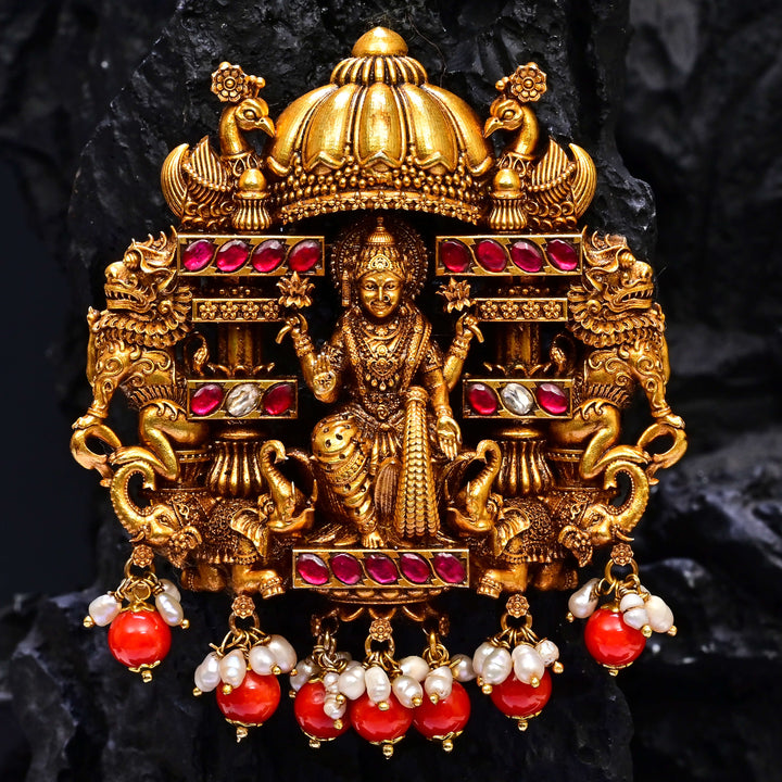 Premium 92.5 silver temple pendant featuring traditional Lakshmi motif, kemp stones, antique finish and intricate handcrafted South Indian design by Sri Fine Jewellery, Hyderabad.
(https://www.srifinejewellery.com)
