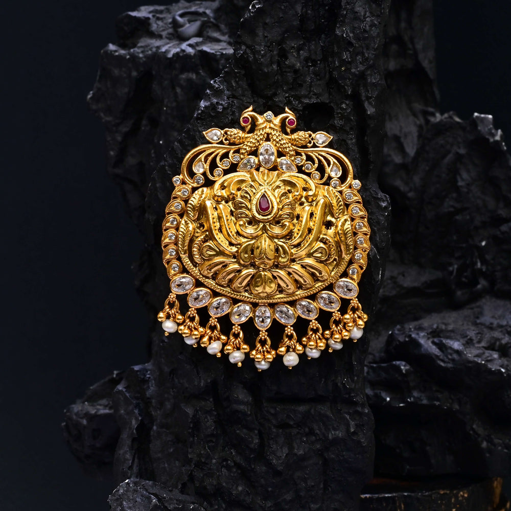 Premium 92.5 silver temple pendant featuring traditional Lakshmi motif, kemp stones, antique finish and intricate handcrafted South Indian design by Sri Fine Jewellery, Hyderabad.
(https://www.srifinejewellery.com)