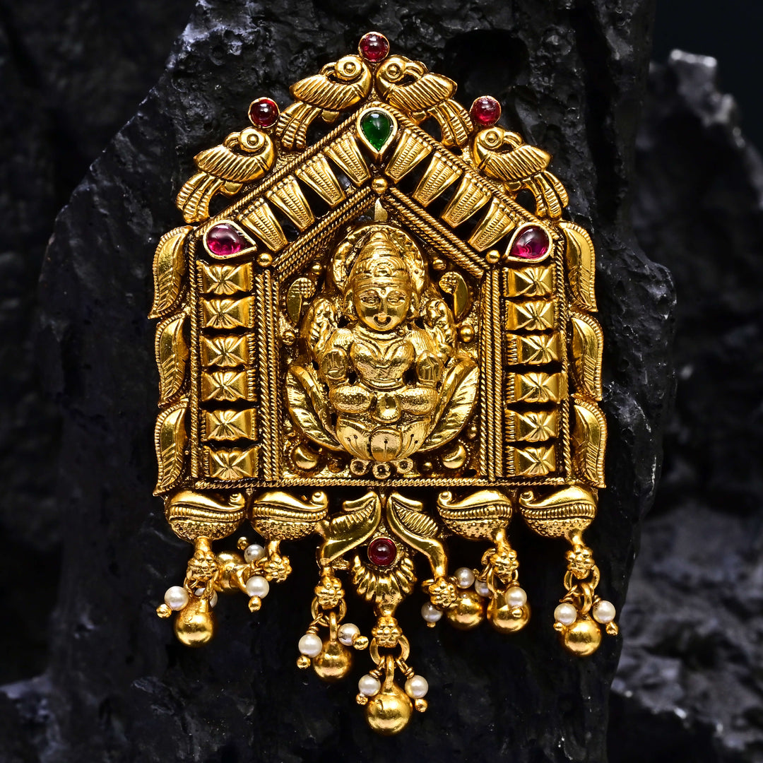 Premium 92.5 silver temple pendant featuring traditional Lakshmi motif, kemp stones, antique finish and intricate handcrafted South Indian design by Sri Fine Jewellery, Hyderabad.
(https://www.srifinejewellery.com)