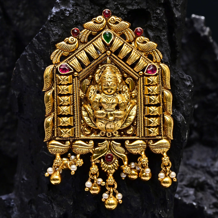 Premium 92.5 silver temple pendant featuring traditional Lakshmi motif, kemp stones, antique finish and intricate handcrafted South Indian design by Sri Fine Jewellery, Hyderabad.
(https://www.srifinejewellery.com)