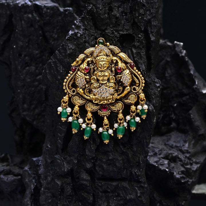 Premium 92.5 silver temple pendant featuring traditional Lakshmi motif, kemp stones, antique finish and intricate handcrafted South Indian design by Sri Fine Jewellery, Hyderabad.
(https://www.srifinejewellery.com)