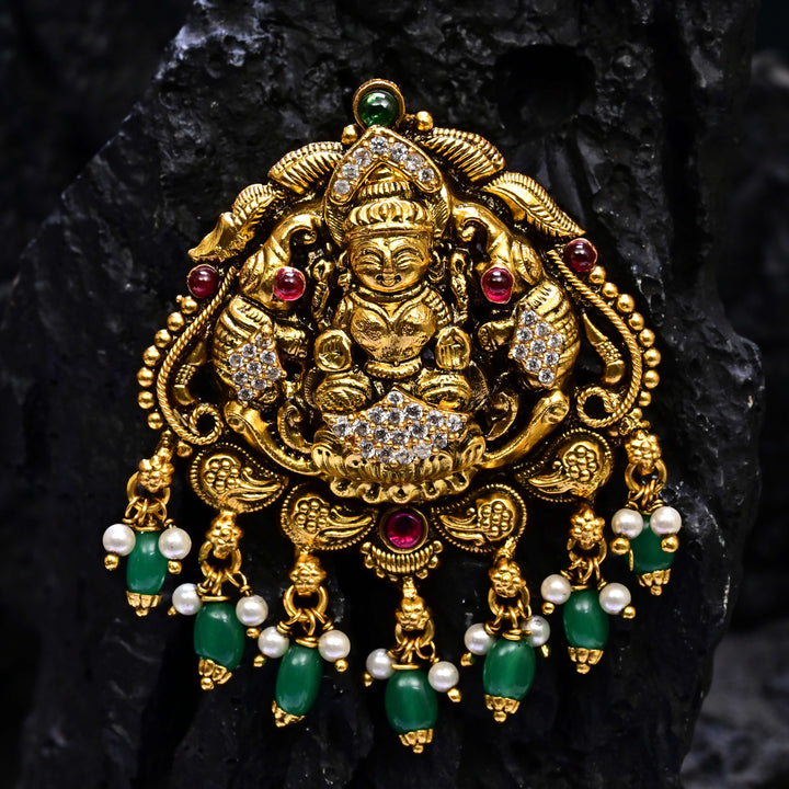 Premium 92.5 silver temple pendant featuring traditional Lakshmi motif, kemp stones, antique finish and intricate handcrafted South Indian design by Sri Fine Jewellery, Hyderabad.
(https://www.srifinejewellery.com)