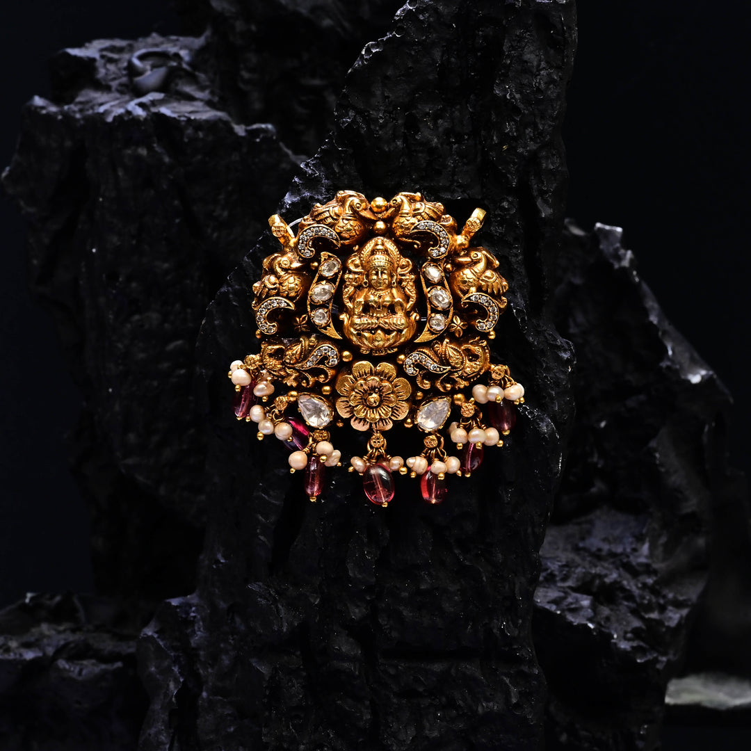 Premium 92.5 silver temple pendant featuring traditional Lakshmi motif, kemp stones, antique finish and intricate handcrafted South Indian design by Sri Fine Jewellery, Hyderabad.
(https://www.srifinejewellery.com)