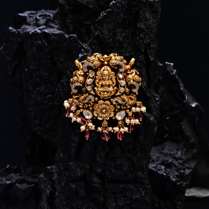 Premium 92.5 silver temple pendant featuring traditional Lakshmi motif, kemp stones, antique finish and intricate handcrafted South Indian design by Sri Fine Jewellery, Hyderabad.
(https://www.srifinejewellery.com)