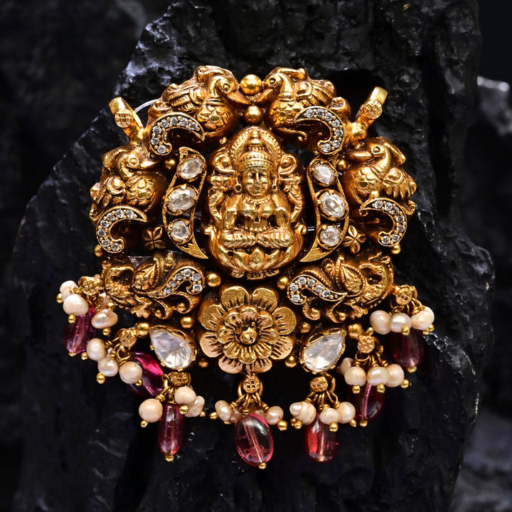 Premium 92.5 silver temple pendant featuring traditional Lakshmi motif, kemp stones, antique finish and intricate handcrafted South Indian design by Sri Fine Jewellery, Hyderabad.
(https://www.srifinejewellery.com)