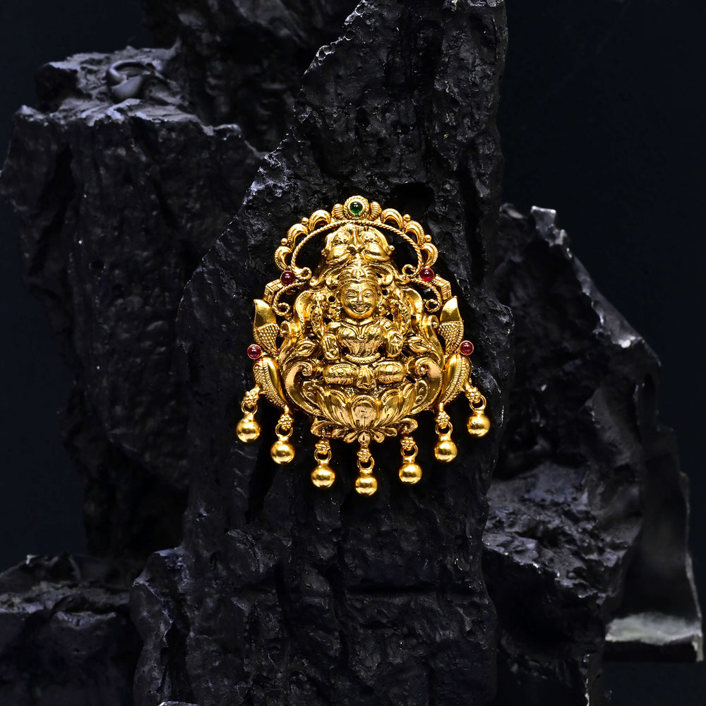 Premium 92.5 silver temple pendant featuring traditional Lakshmi motif, kemp stones, antique finish and intricate handcrafted South Indian design by Sri Fine Jewellery, Hyderabad.
(https://www.srifinejewellery.com)
