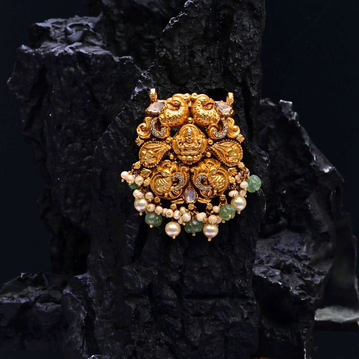 Premium 92.5 silver temple pendant featuring traditional emerald kemp stones, Lakshmi motif, antique finish, and intricate handcrafted South Indian design by Sri Fine Jewellery, Hyderabad.
(https://www.srifinejewellery.com)
