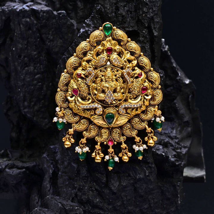 Premium 92.5 silver temple pendant featuring traditional ruby kemp stones, Lakshmi motif antique finish, and intricate handcrafted South Indian design by Sri Fine Jewellery, Hyderabad.
(https://www.srifinejewellery.com)