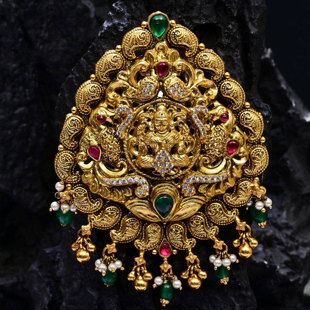 Premium 92.5 silver temple pendant featuring traditional ruby kemp stones antique finish, and intricate handcrafted South Indian design by Sri Fine Jewellery, Hyderabad.
(https://www.srifinejewellery.com)