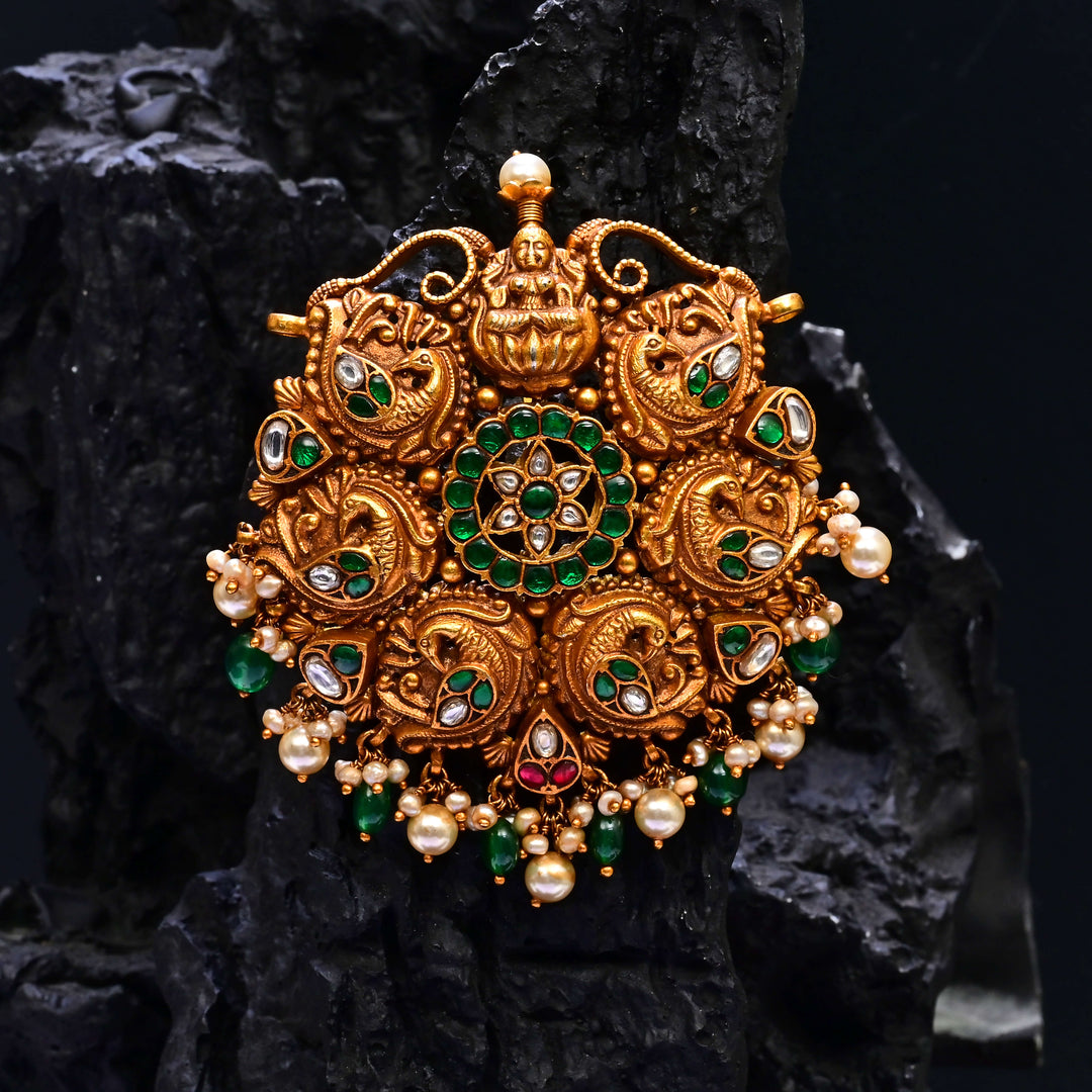 Premium 92.5 silver temple pendant featuring traditional emerald kemp stones, Lakshmi motif, antique finish, and intricate handcrafted South Indian design by Sri Fine Jewellery, Hyderabad.
(https://www.srifinejewellery.com)