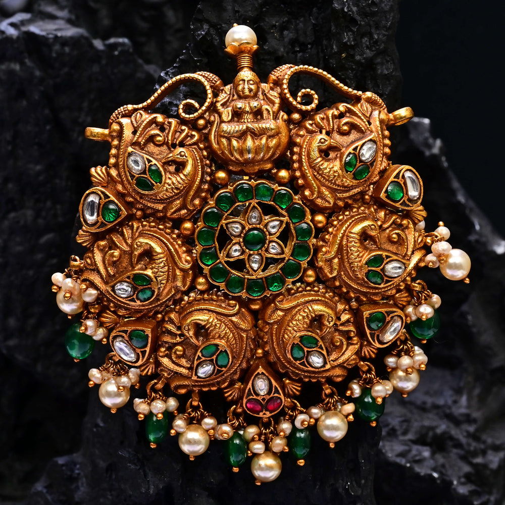 Premium 92.5 silver temple pendant featuring traditional emerald kemp stones, Lakshmi motif, antique finish, and intricate handcrafted South Indian design by Sri Fine Jewellery, Hyderabad.
(https://www.srifinejewellery.com)