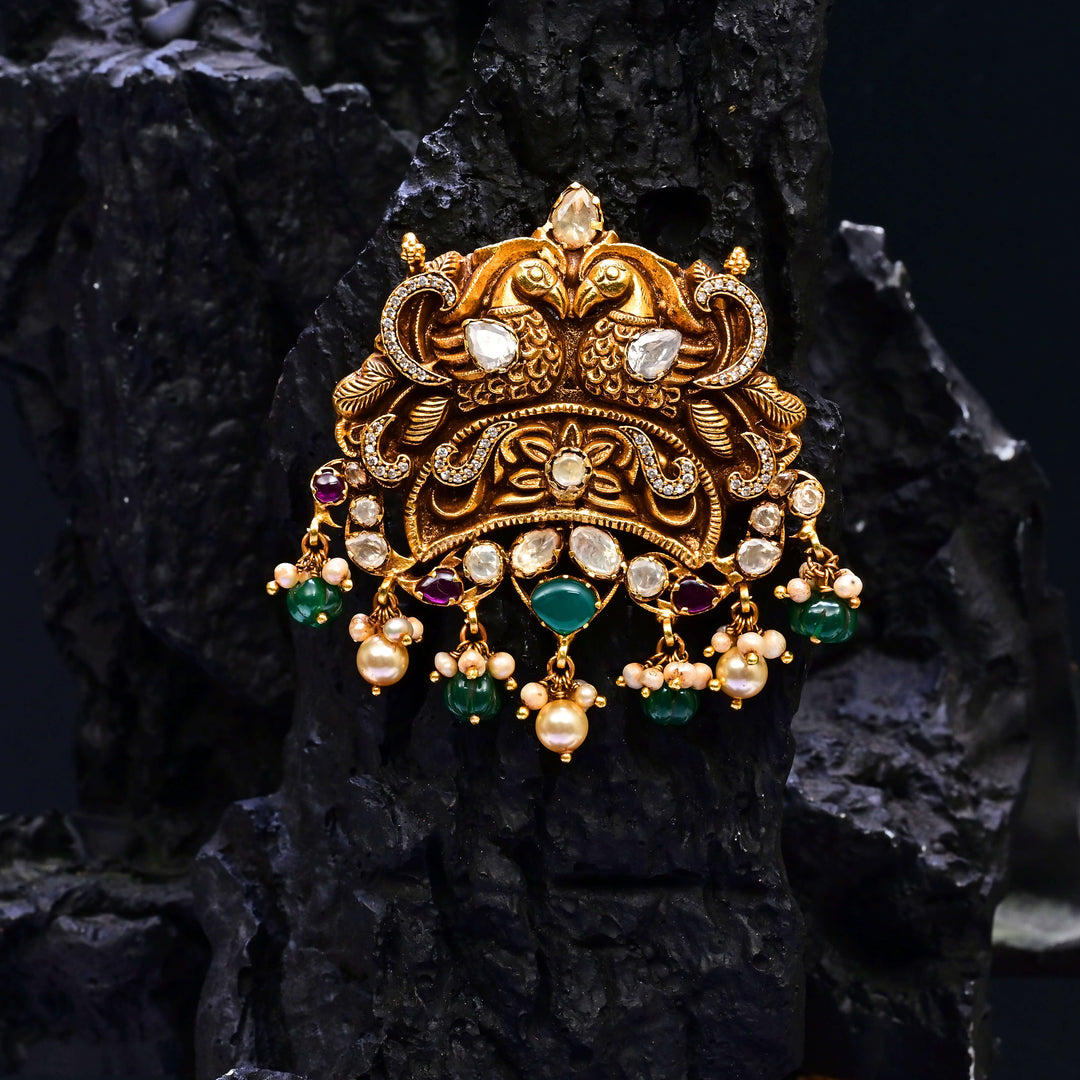 Premium 92.5 silver temple pendant featuring traditional ruby kemp stones, peacock motif, antique finish, and intricate handcrafted South Indian design by Sri Fine Jewellery, Hyderabad.
(https://www.srifinejewellery.com)