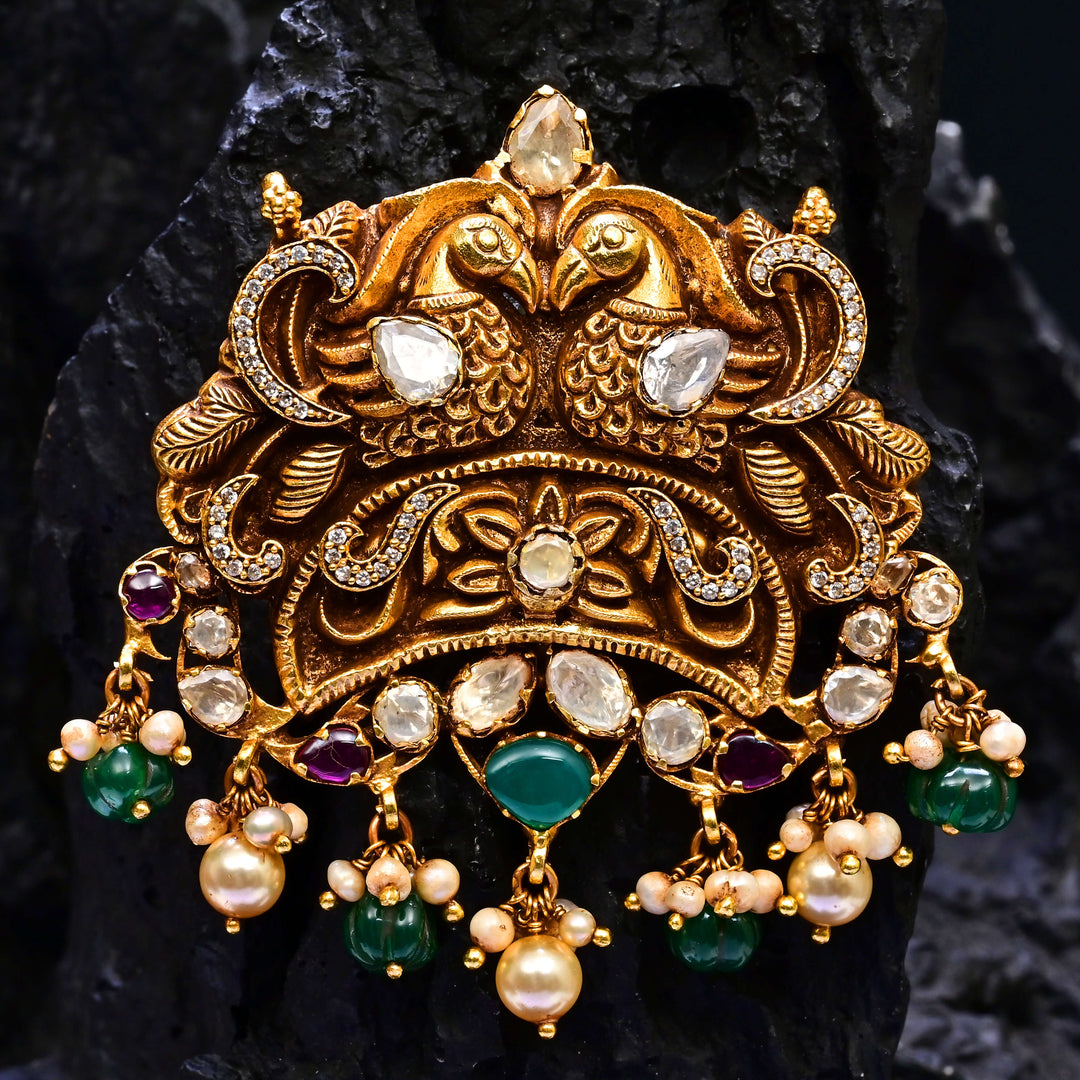 Premium 92.5 silver temple pendant featuring traditional ruby kemp stones, peacock motif, antique finish, and intricate handcrafted South Indian design by Sri Fine Jewellery, Hyderabad.
(https://www.srifinejewellery.com)