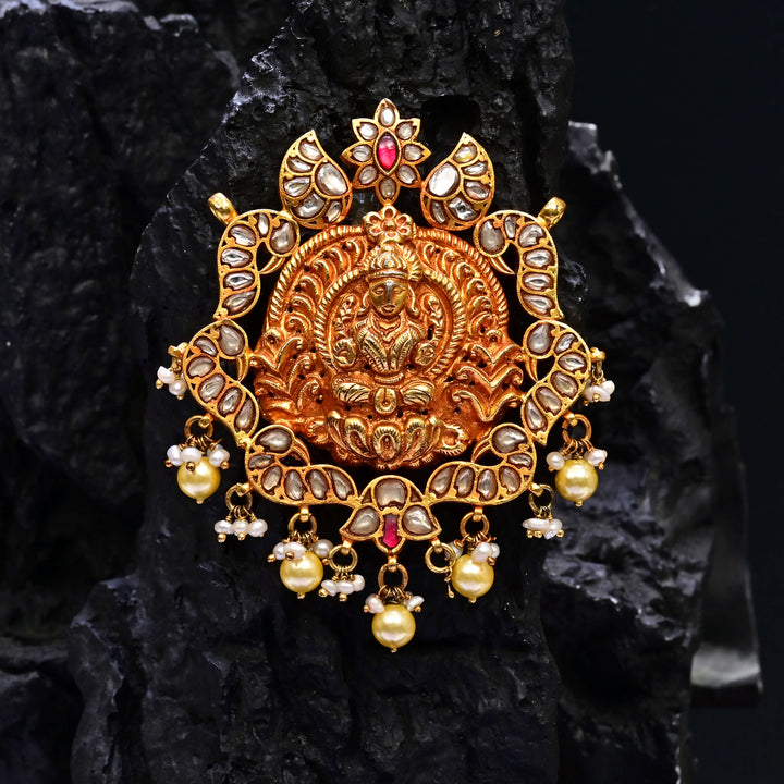 Premium 92.5 silver temple pendant featuring traditional ruby kemp stones, Lakshmi motif, antique finish, and intricate handcrafted South Indian design by Sri Fine Jewellery, Hyderabad.
(https://www.srifinejewellery.com)