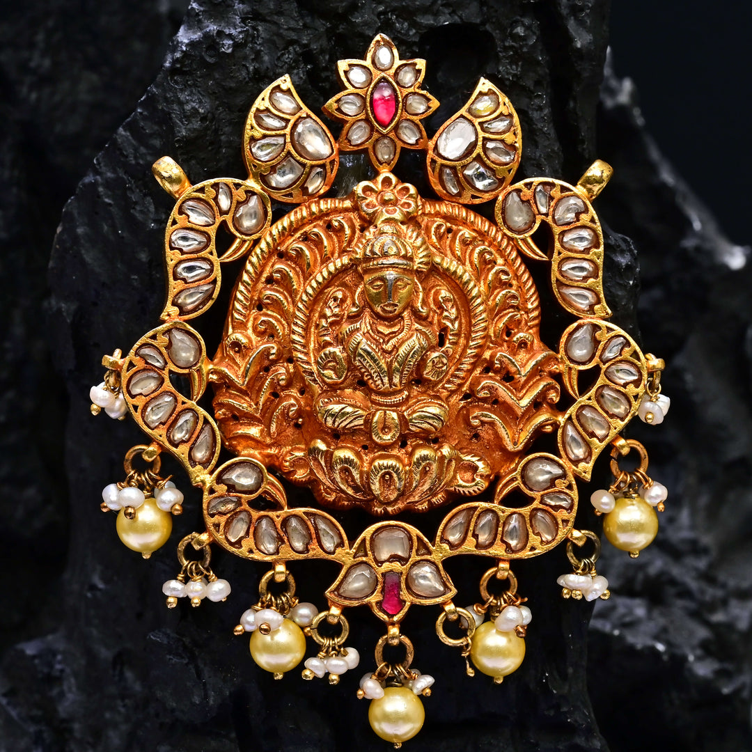 Premium 92.5 silver temple pendant featuring traditional ruby kemp stones, Lakshmi motif, antique finish, and intricate handcrafted South Indian design by Sri Fine Jewellery, Hyderabad.
(https://www.srifinejewellery.com)