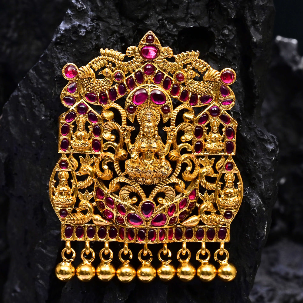 Premium 92.5 silver temple pendant featuring traditional ruby kemp stones, Lakshmi motif, antique finish, and intricate handcrafted South Indian design by Sri Fine Jewellery, Hyderabad.
(https://www.srifinejewellery.com)