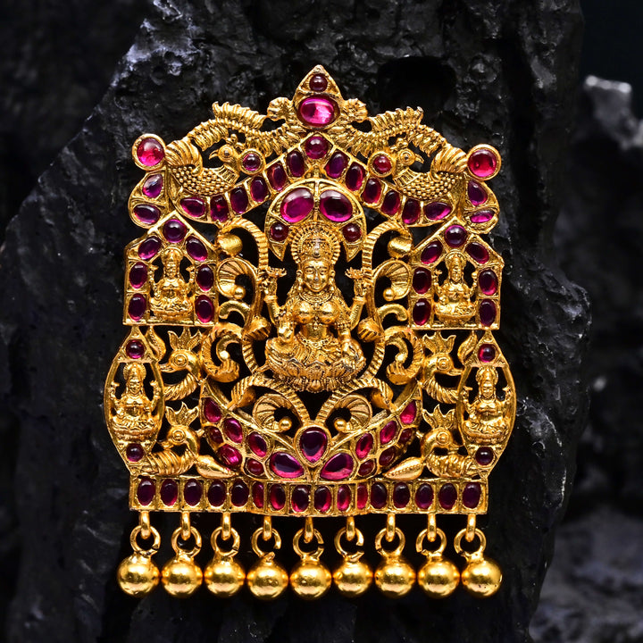 Premium 92.5 silver temple pendant featuring traditional ruby kemp stones, Lakshmi motif, antique finish, and intricate handcrafted South Indian design by Sri Fine Jewellery, Hyderabad.
(https://www.srifinejewellery.com)