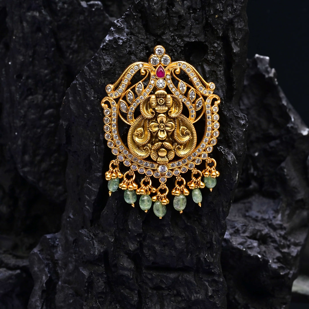 Premium 92.5 silver temple pendant featuring traditional ruby kemp stones, antique finish, and intricate handcrafted South Indian design by Sri Fine Jewellery, Hyderabad.
(https://www.srifinejewellery.com)