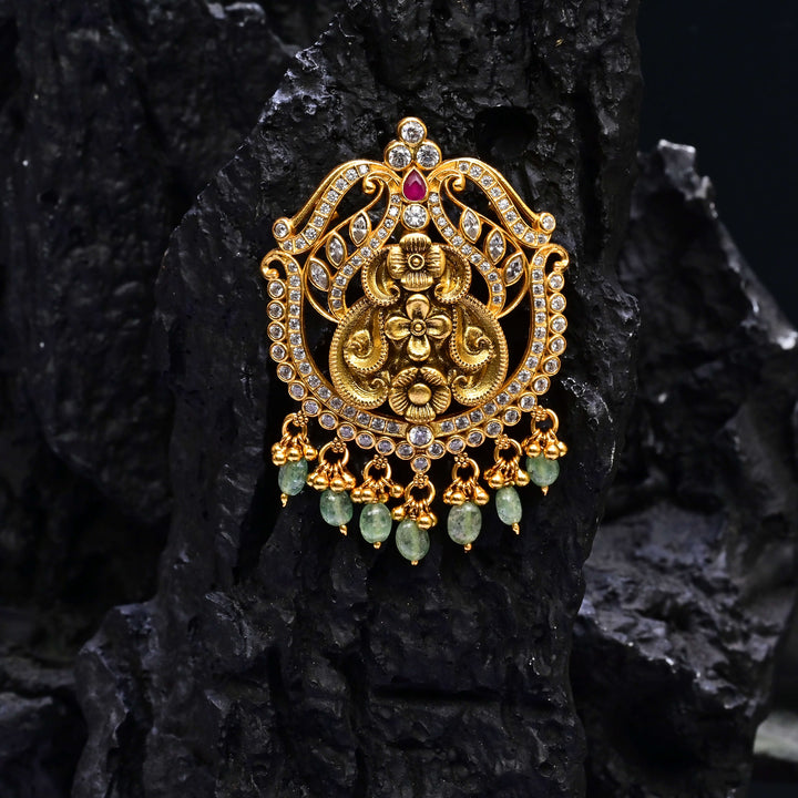 Premium 92.5 silver temple pendant featuring traditional ruby kemp stones, antique finish, and intricate handcrafted South Indian design by Sri Fine Jewellery, Hyderabad.
(https://www.srifinejewellery.com)