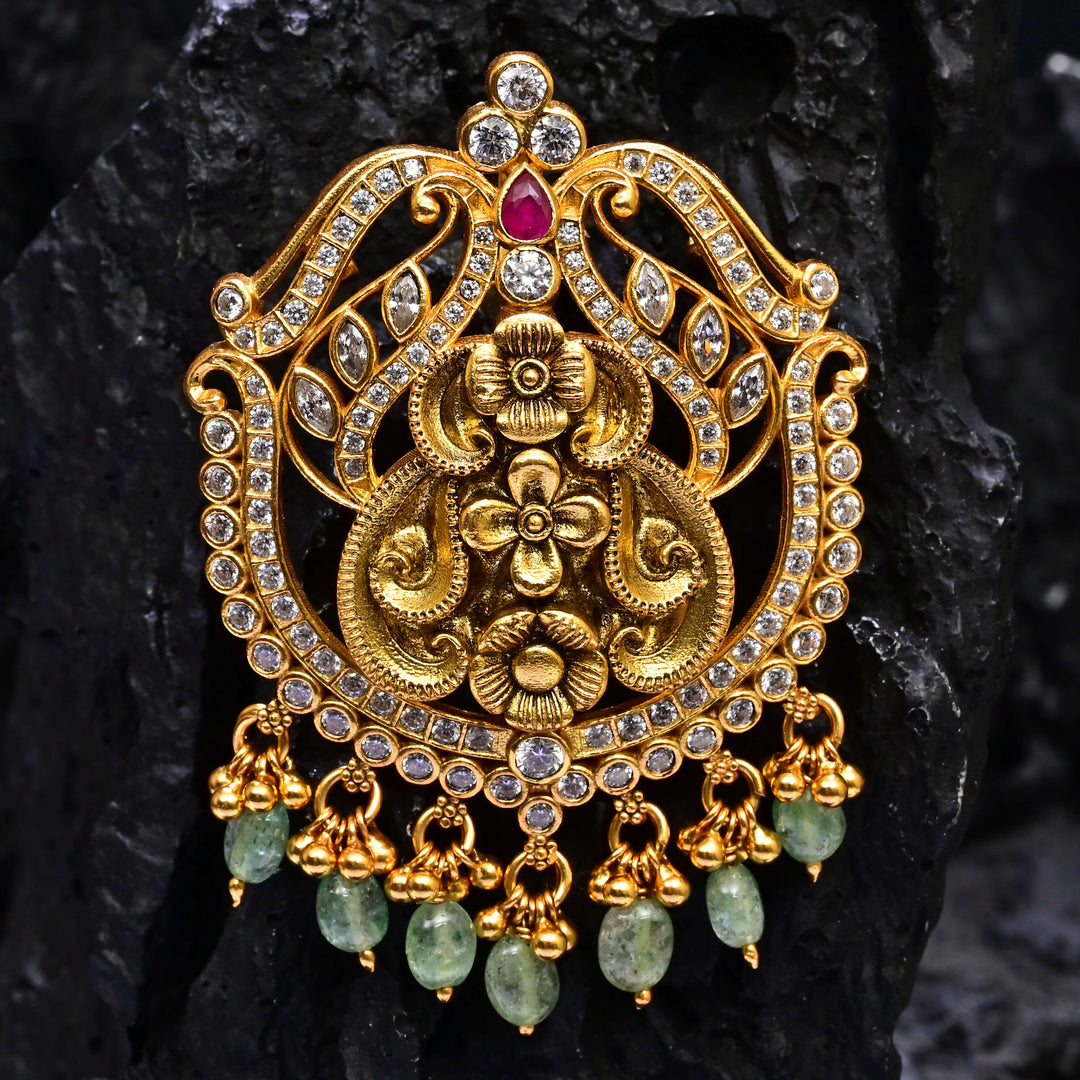 Premium 92.5 silver temple pendant featuring traditional ruby kemp stones, antique finish, and intricate handcrafted South Indian design by Sri Fine Jewellery, Hyderabad.
(https://www.srifinejewellery.com)