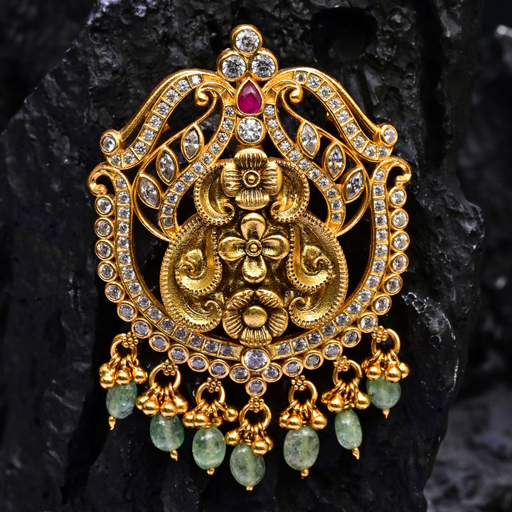 Premium 92.5 silver temple pendant featuring traditional ruby kemp stones, antique finish, and intricate handcrafted South Indian design by Sri Fine Jewellery, Hyderabad.
(https://www.srifinejewellery.com)