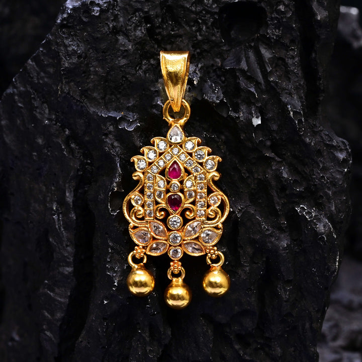 Premium 92.5 silver temple pendant featuring traditional ruby kemp stones, antique finish, and intricate handcrafted South Indian design by Sri Fine Jewellery, Hyderabad.
(https://www.srifinejewellery.com)