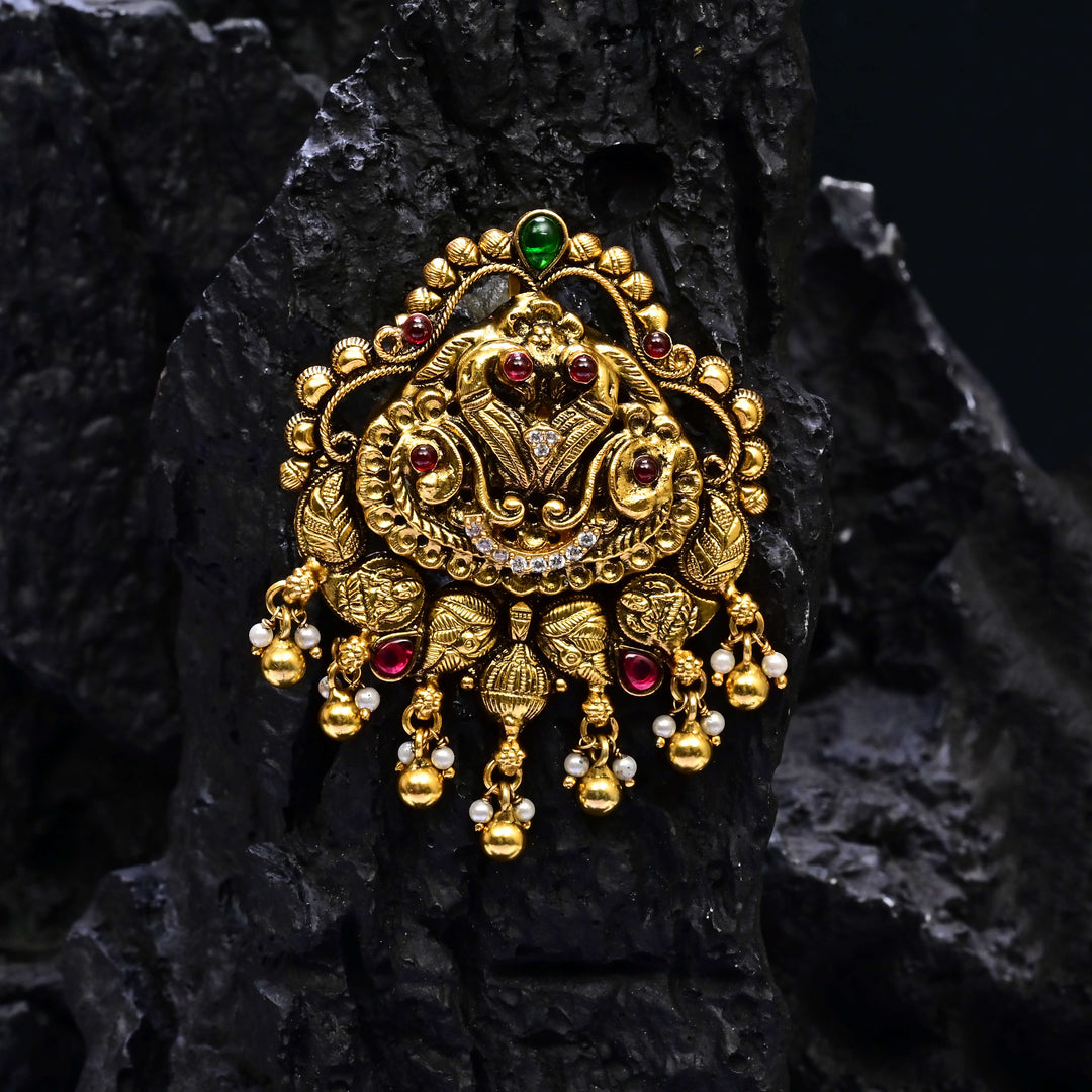 Premium 92.5 silver temple pendant featuring traditional peacock motif, ruby kemp stones, antique finish, and intricate handcrafted South Indian design by Sri Fine Jewellery, Hyderabad.
(https://www.srifinejewellery.com)