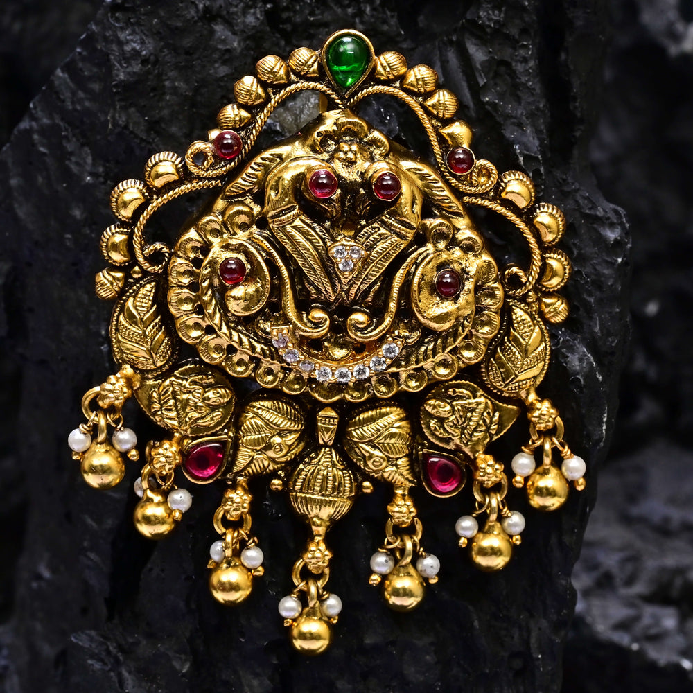 Premium 92.5 silver temple pendant featuring traditional peacock motif, ruby kemp stones, antique finish, and intricate handcrafted South Indian design by Sri Fine Jewellery, Hyderabad.
(https://www.srifinejewellery.com)