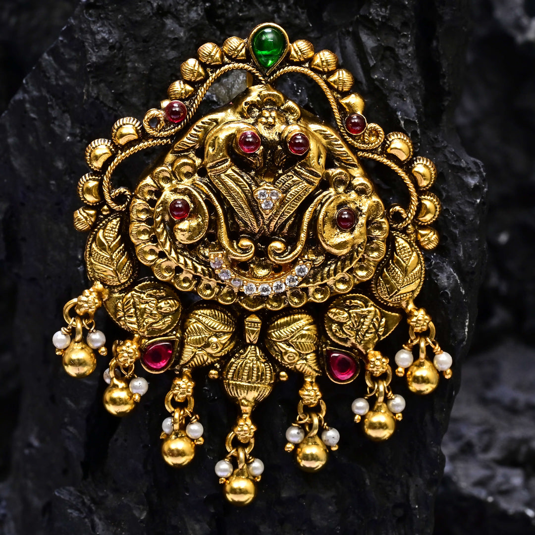 Premium 92.5 silver temple pendant featuring traditional peacock motif, ruby kemp stones, antique finish, and intricate handcrafted South Indian design by Sri Fine Jewellery, Hyderabad.
(https://www.srifinejewellery.com)