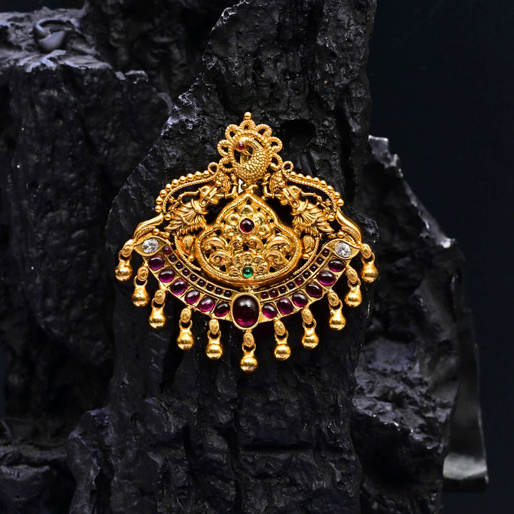 Premium 92.5 silver temple pendant featuring traditional Lakshmi motif, ruby kemp stones, antique finish, and intricate handcrafted South Indian design by Sri Fine Jewellery, Hyderabad.
(https://www.srifinejewellery.com)