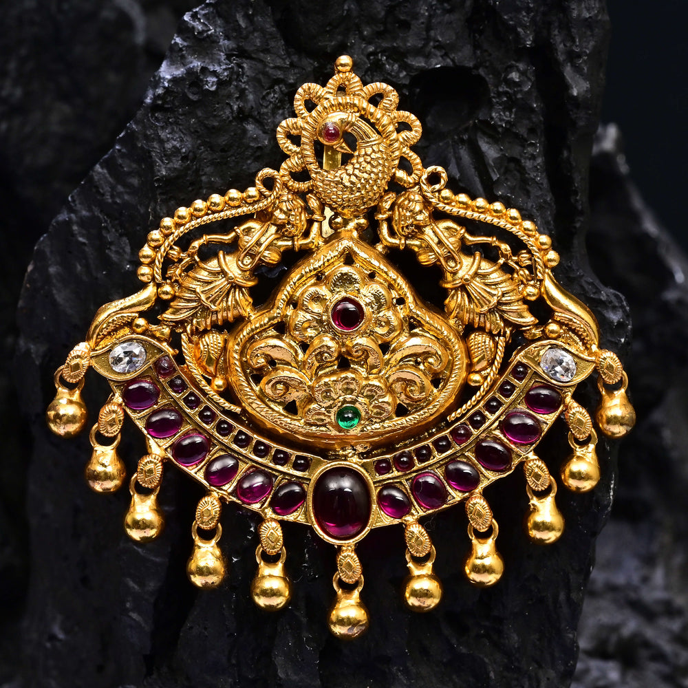 Premium 92.5 silver temple pendant featuring traditional Lakshmi motif, ruby kemp stones, antique finish, and intricate handcrafted South Indian design by Sri Fine Jewellery, Hyderabad.
(https://www.srifinejewellery.com)