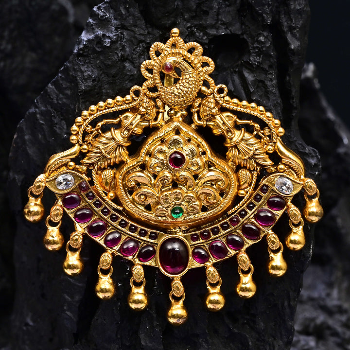 Premium 92.5 silver temple pendant featuring traditional Lakshmi motif, ruby kemp stones, antique finish, and intricate handcrafted South Indian design by Sri Fine Jewellery, Hyderabad.
(https://www.srifinejewellery.com)